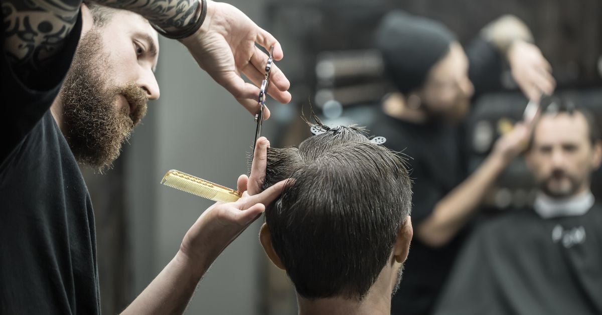 Cutting hair on man